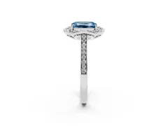 Fancy Blue Emerald Cut Diamond Halo Ring Set in Platinum with Pavé-Lined Shoulders and Prong Setting