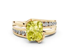 Fancy Yellow Radiant Cut Diamond Solitaire Ring Set in Yellow gold with Channel Set Split Shank and Tension Prongs