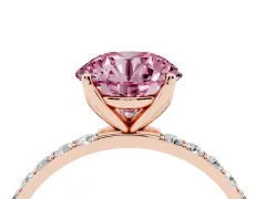 Fancy Pink Round Cut Diamond Solitaire Engagement Ring Set in Rose gold with Round Pavé Band and Prong Setting