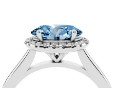 Fancy Blue Oval Cut Diamond Halo Engagement Ring Set in Platinum with Pavé Band and Rising Shoulders