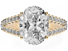 Oval Cut Diamond Split Shank Pavé Engagement Ring Set in Yellow gold with Prong-Held Center Stone