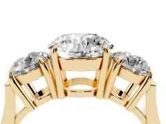 Round Cut Diamond Three-Stone Ring Set in Yellow gold with Round Accent Stones and Plain Band