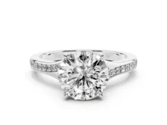 Round Cut Diamond Solitaire Ring Set in White gold with Pavé Accent Band and Classic Prong Setting
