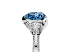 Fancy Blue Heart Cut Diamond Three-Stone Ring Set in White gold with Pavé Band and Smaller Side Stones