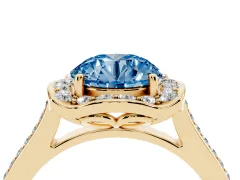 Fancy Blue Round Cut Diamond Halo Ring Set in Yellow gold with Pavé-Lined Shoulders and Prong Setting