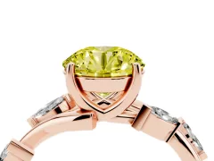 Fancy Yellow Round Cut Diamond Solitaire Ring Set in Rose gold with Twisted Marquise Accent Band
