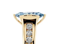 Fancy Blue Marquise Cut Diamond Bezel-Set Solitaire Ring Set in Yellow gold with Channel-Set Band
