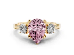Fancy Pink Pear Cut Diamond Three-Stone Ring Set in Yellow gold with Pavé Band and Smaller Side Stones