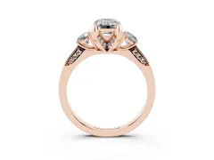Fancy Pink Emerald Cut Diamond Three-Stone Ring Set in Rose gold with Pavé Band and Smaller Side Stones