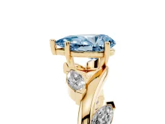 Fancy Blue Pear Cut Diamond Solitaire Ring Set in Yellow gold with Twisted Marquise Accent Band