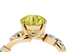 Fancy Yellow Round Cut Diamond Solitaire Ring Set in Yellow gold with Twisted Marquise Accent Band