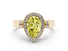 Fancy Yellow Pear Cut Diamond Halo Ring Set in Yellow gold with Pavé-Lined Split Shank Band