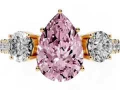 Fancy Pink Pear Cut Diamond Three-Stone Ring Set in Yellow gold with Round Side Stones and Delicate Pavé Band