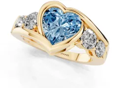 Fancy Blue Heart Cut Diamond Bezel Bypass Ring Set in Yellow gold with Round Accents