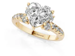 Heart Cut Diamond Three-Stone Pavé Ring Set in Yellow gold with Prong Setting