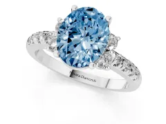 Fancy Blue Oval Cut Diamond Three-Stone Pavé Ring Set in Silver with Prong Setting