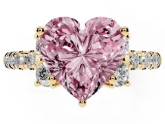Fancy Pink Heart Cut Diamond Three-Stone Pavé Ring Set in Yellow gold with Prong Setting