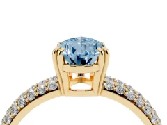 Fancy Blue Pear Cut Diamond Solitaire Ring Set in Yellow gold with Multi-Row Round Pavé Band and Prong Setting