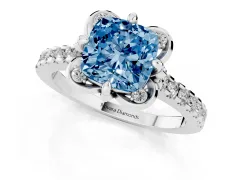 Fancy Blue Cushion Cut Diamond Solitaire Ring Set in White gold with Pavé Band and Floral Prong Setting