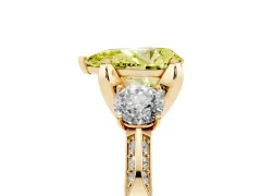 Fancy Yellow Pear Cut Diamond Three-Stone Ring Set in Yellow gold with Pavé Band and Smaller Side Stones