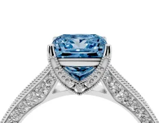 Fancy Blue Princess Cut Diamond Solitaire Ring Set in White gold with Milgrain-Edged Pavé Band and Prong Setting