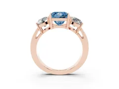 Fancy Blue Princess Cut Diamond Three-Stone Ring Set in Rose gold with Round Side Stones and Classic Band