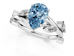 Fancy Blue Pear Cut Diamond Solitaire Ring Set in White gold with Twisted Marquise Accent Band