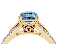 Fancy Blue Emerald Cut Diamond Split Shank Pavé Engagement Ring Set in Yellow gold with Prong-Set Center Stone