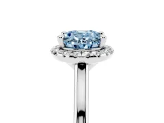 Fancy Blue Oval Cut Diamond Halo Engagement Ring Set in White gold with Pavé Band and Rising Shoulders