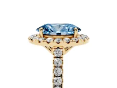 Fancy Blue Oval Cut Diamond Pavé Halo Engagement Ring Set in Yellow gold with Pavé Band and Prong Setting