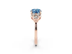 Fancy Blue Round Cut Diamond Solitaire Ring Set in Rose gold with Cluster Accents on Each Side
