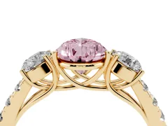 Fancy Pink Pear Cut Diamond Three-Stone Ring Set in Yellow gold with Round Side Stones and Delicate Pavé Band