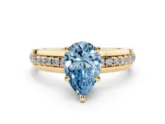 Fancy Blue Pear Cut Diamond Solitaire Ring Set in Yellow gold with Channel Set Band and Prong Setting