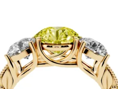 Fancy Yellow Round Cut Diamond Three-Stone Engagement Ring Set in Yellow gold with Milgrain Pavé Band