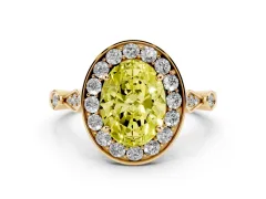 Fancy Yellow Oval Cut Diamond Halo Engagement Ring Set in Yellow gold with Twisted Band and Prong Setting