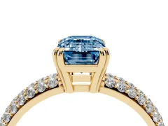 Fancy Blue Emerald Cut Diamond Solitaire Ring Set in Yellow gold with Multi-Row Round Pavé Band and Prong Setting