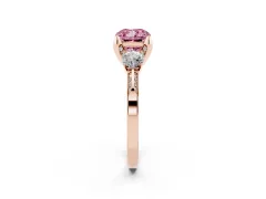 Fancy Pink Cushion Cut Diamond Three-Stone Ring Set in Rose gold with Pavé Band and Smaller Side Stones