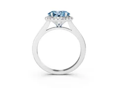 Fancy Blue Oval Cut Diamond Halo Engagement Ring Set in Platinum with Pavé Band and Rising Shoulders
