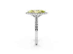 Fancy Yellow Marquise Cut Diamond Pavé Halo Engagement Ring Set in White gold with Pavé Band and Prong Setting