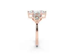 Marquise Cut Diamond Solitaire Ring Set in Rose gold with Cluster Accents on Each Side