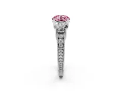 Fancy Pink Round Cut Diamond Three-Stone Engagement Ring Set in Platinum with Milgrain Pavé Band