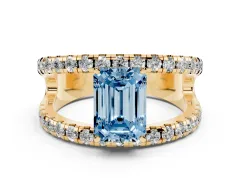 Fancy Blue Emerald Cut Diamond Split Shank Pavé Solitaire Ring Set in Yellow gold with Open Shank Design
