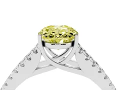 Fancy Yellow Oval Cut Diamond Split Shank Pavé Engagement Ring Set in White gold with Prong-Held Center Stone