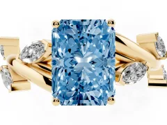 Fancy Blue Radiant Cut Diamond Solitaire Ring Set in Yellow gold with Twisted Marquise Accent Band