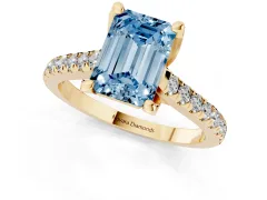 Fancy Blue Emerald Cut Diamond Solitaire Ring Set in Yellow gold with Brilliant Pavé Band and Prong Setting
