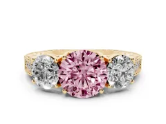 Fancy Pink Round Cut Diamond Three-Stone Engagement Ring Set in Yellow gold with Milgrain Pavé Band