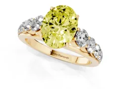 Fancy Yellow Oval Cut Diamond Solitaire Ring Set in Yellow gold with Pavé-Set Band and Prong Setting