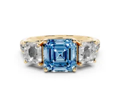 Fancy Blue Asscher Cut Diamond Three-Stone Ring Set in Yellow gold with Pavé Band