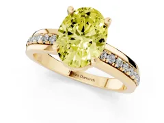 Fancy Yellow Oval Cut Diamond Solitaire Ring Set in Yellow gold with Channel Set Band and Prong Setting