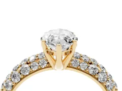 Marquise Cut Diamond Pavé Band Solitaire Ring Set in Yellow gold with Close-Set Accent Stones and Prong Setting